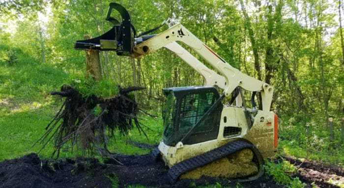 Tree Puller attachment doing some clearing on land