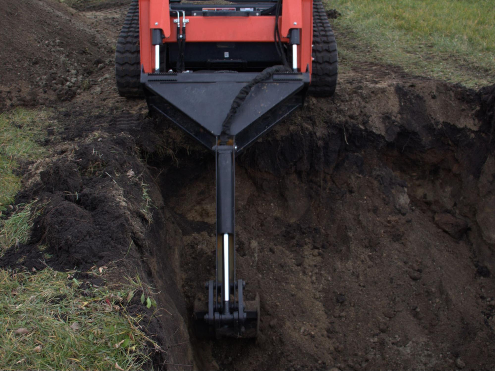 Get the Most From a Skid Steer Backhoe Around Landscapes & Hardscapes