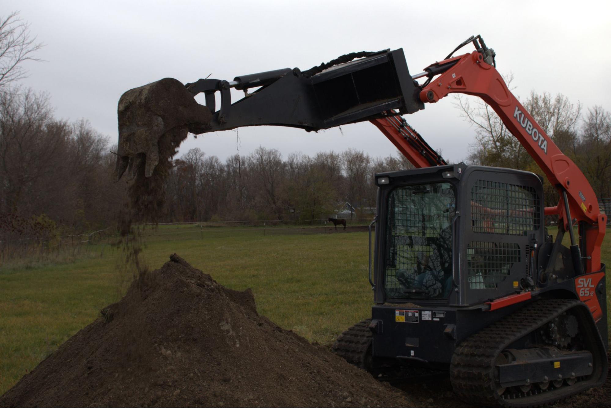 Why You Need a Backhoe Attachment for Your Skid Steer